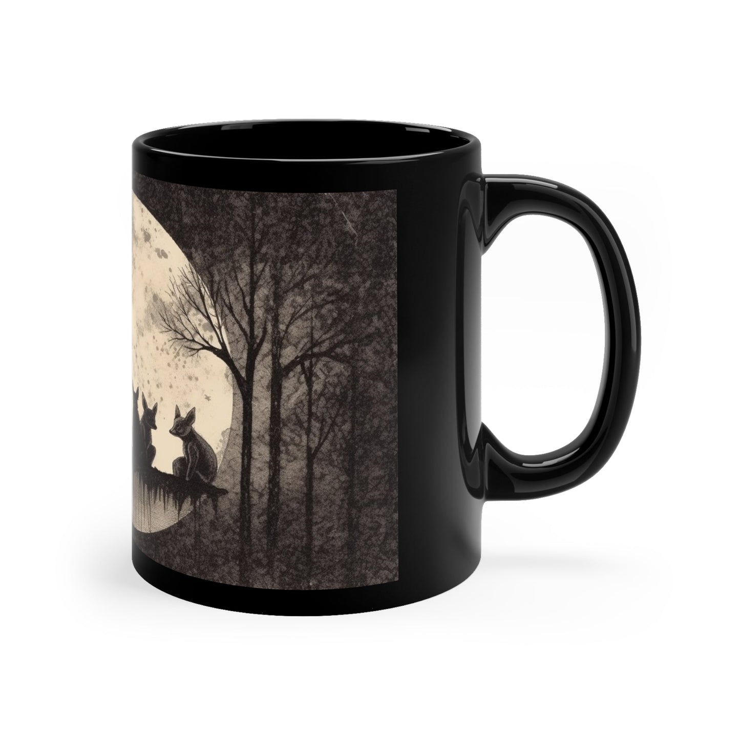 a black coffee mug with an illustration of foxes sitting in front of a full moon in a forest printed on it.